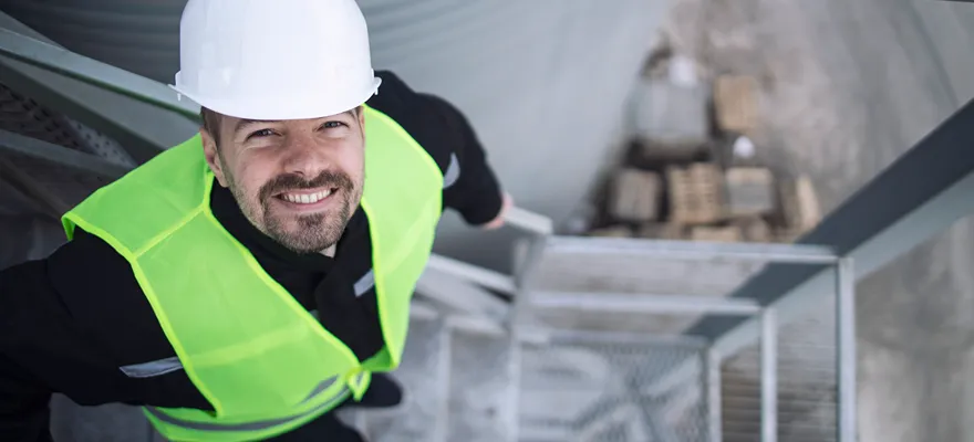 industrial-factory-worker-protective-equipment-standing-metal-staircase-production-plant